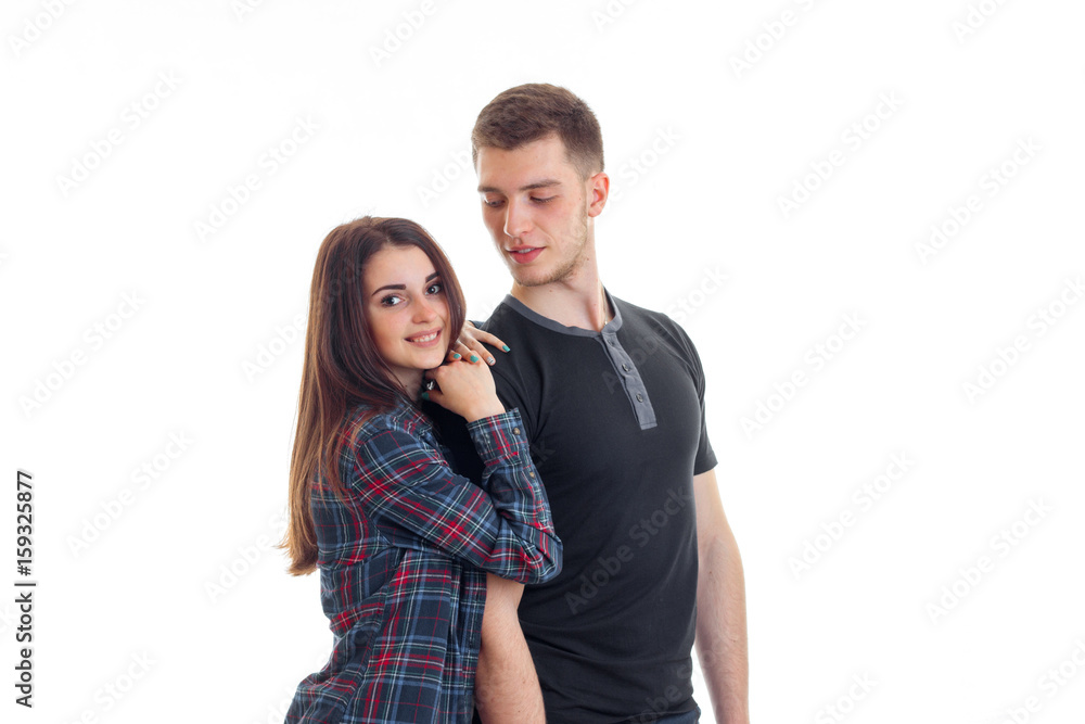 wonderful cute couple stand in the Studio and posing for the camera isolated on a white background wonderful cute couple stand in the Studio and posing for the camera isolated on a white background