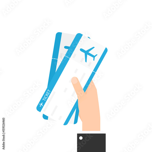 Hand holding two air tickets