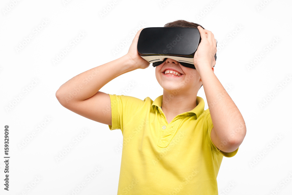 Smiling boy enjoying VR goggles Smiling boy enjoying VR goggles