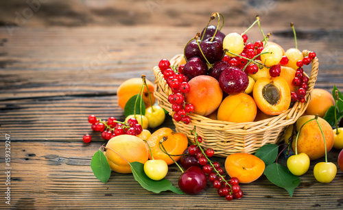 Obraz na plátně Fresh summer fruits in the basket