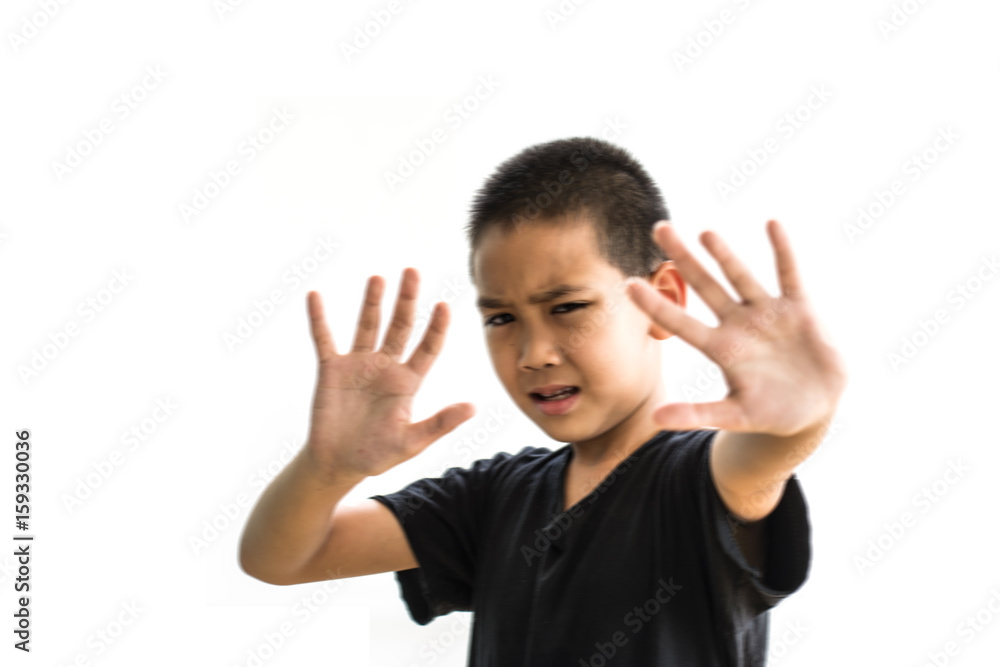 Stop abusing boy violence. child bondage , Human Rights Day concept. Scared boy making a stop gesture, blur concept Stop abusing boy violence. child bondage , Human Rights Day concept. Scared boy making a stop gesture, blur concept