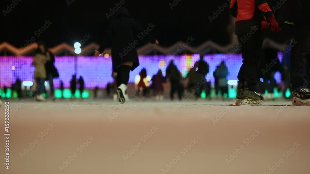 Moscow. Skating rink in the open air. People skate in the winter. Evening time. Christmas lights. Moscow. Skating rink in the open air. People skate in the winter. Evening time. Christmas lights.
