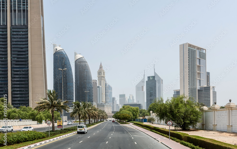 Palm Tree Lined Street Through Dubai on Sunny Day Palm Tree Lined Street Through Dubai on Sunny Day