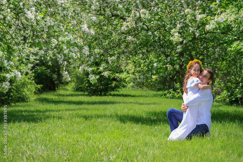 Father and daughter in nature. Hugging each other. Happy family. Father and daughter in nature. Hugging each other. Happy family.