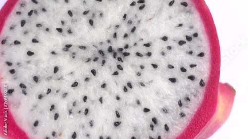 Juicy tropical dragon fruit rotates. Close-up of pitahaya on white background.