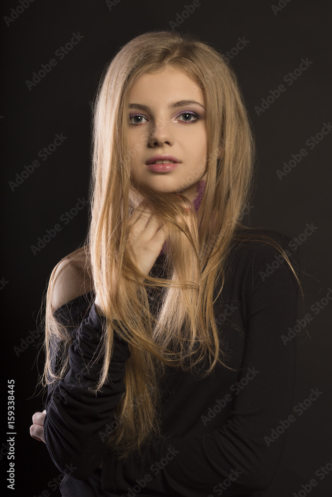 Lovely young woman with perfect makeup posing at studio Lovely young woman with perfect makeup posing at studio