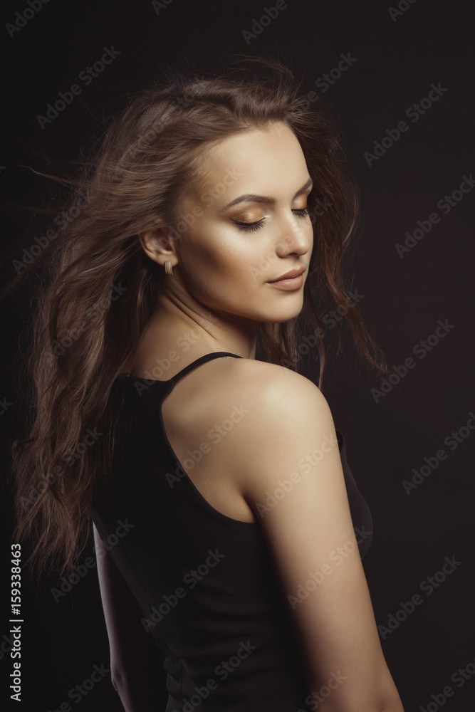 Closeup portrait of brunette model with curly hair and closed eyes Closeup portrait of brunette model with curly hair and closed eyes