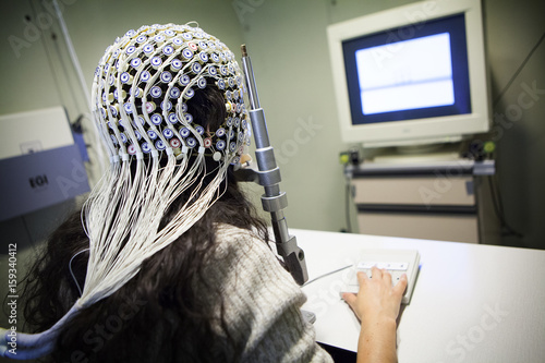 Female patient under EEG test in operating room photo