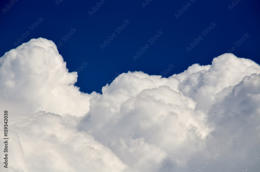 Blue sky with white and gray cumulus clouds. Closeup Blue sky with white and gray cumulus clouds. Closeup
