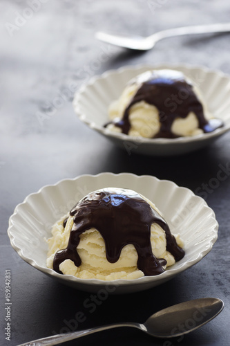 Two Scoops of Vanilla Ice Cream with Chocolate Sauce photo