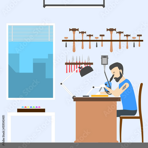 Jeweler at office.