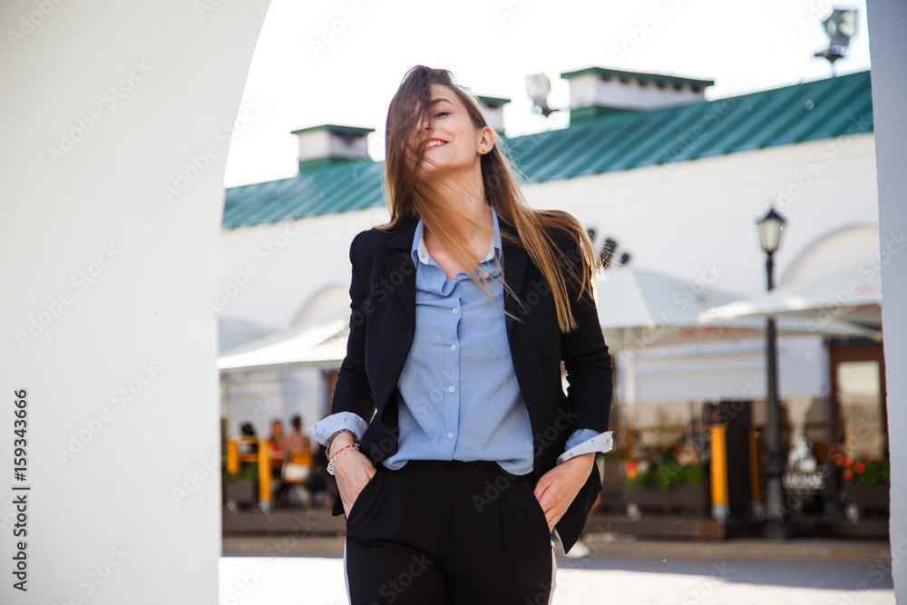 Smiling young business woman portrait in suit with beautiful long hair Smiling young business woman portrait in suit with beautiful long hair