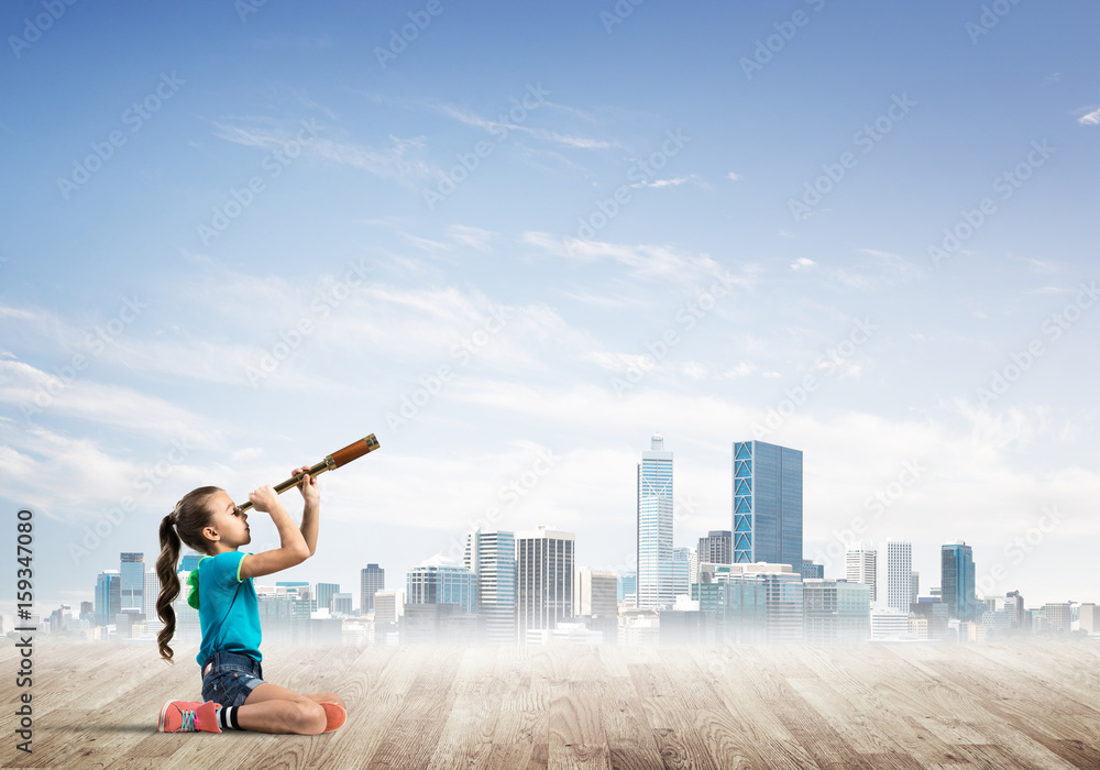 Concept of careless happy childhood with girl dreaming about future Concept of careless happy childhood with girl dreaming about future