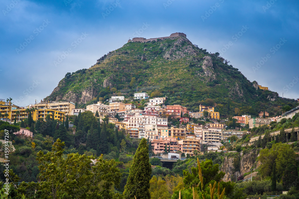 Taormina, Sicily - The castle of Monte Tauro Taormina Castelmola and sanctuary Madonna of the fort with blue sky