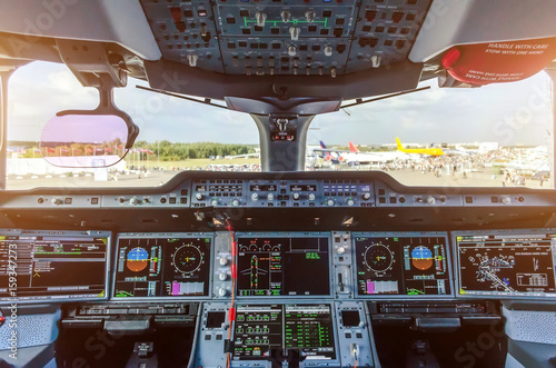 Modern cockpit in the passenger airliner photo