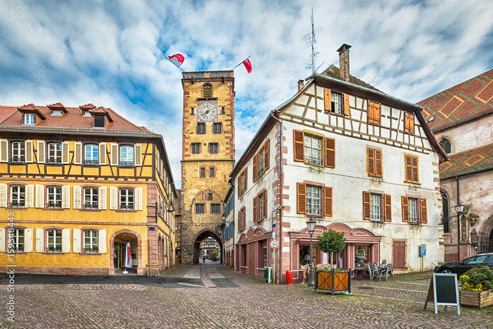 HDR-image of historical clock tower with gate in Ribeauville, Alsace, France