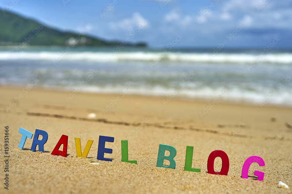Naklejka premium TRAVEL BLOG wood letters on the beach