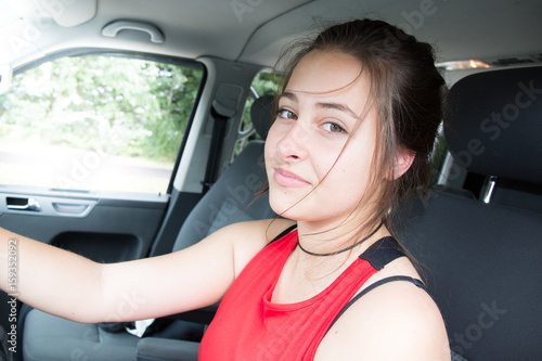 cheerful brunette girl in car © OceanProd