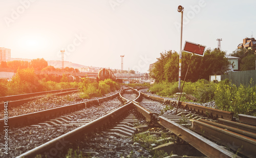 Two railways tracks merge close up.Vintage tone. photo
