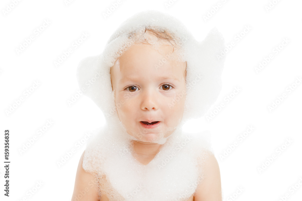 Funny little child in a bubble bath with soap foam, isolared white Funny little child in a bubble bath with soap foam, isolared white
