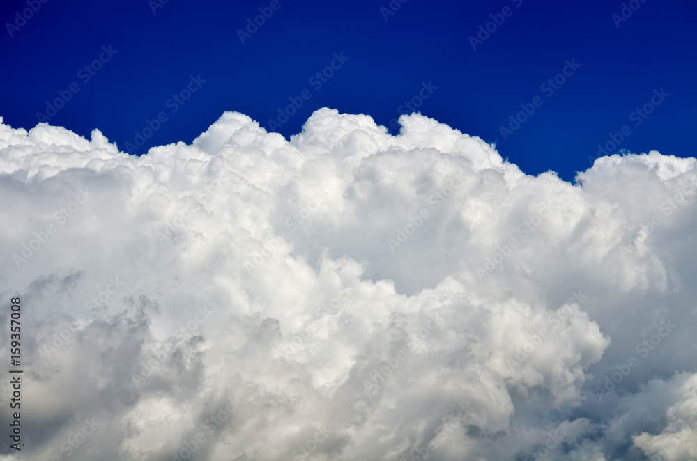 Blue sky with white and gray cumulus clouds. Closeup Blue sky with white and gray cumulus clouds. Closeup