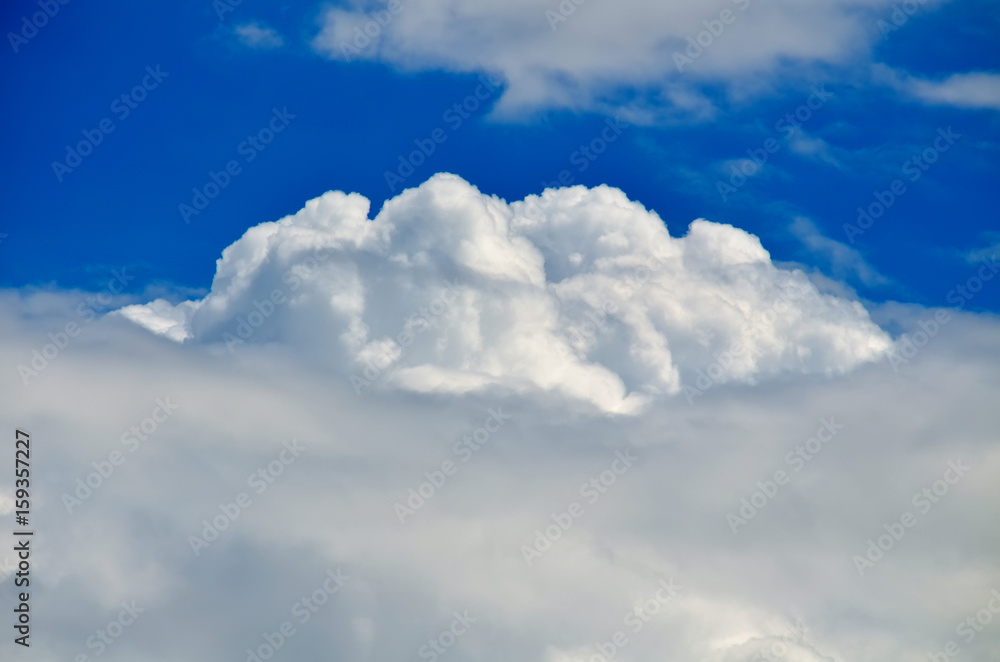Blue sky with white and gray cumulus clouds. Closeup Blue sky with white and gray cumulus clouds. Closeup