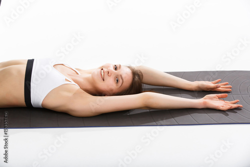 Young woman exercise yoga supported headstand