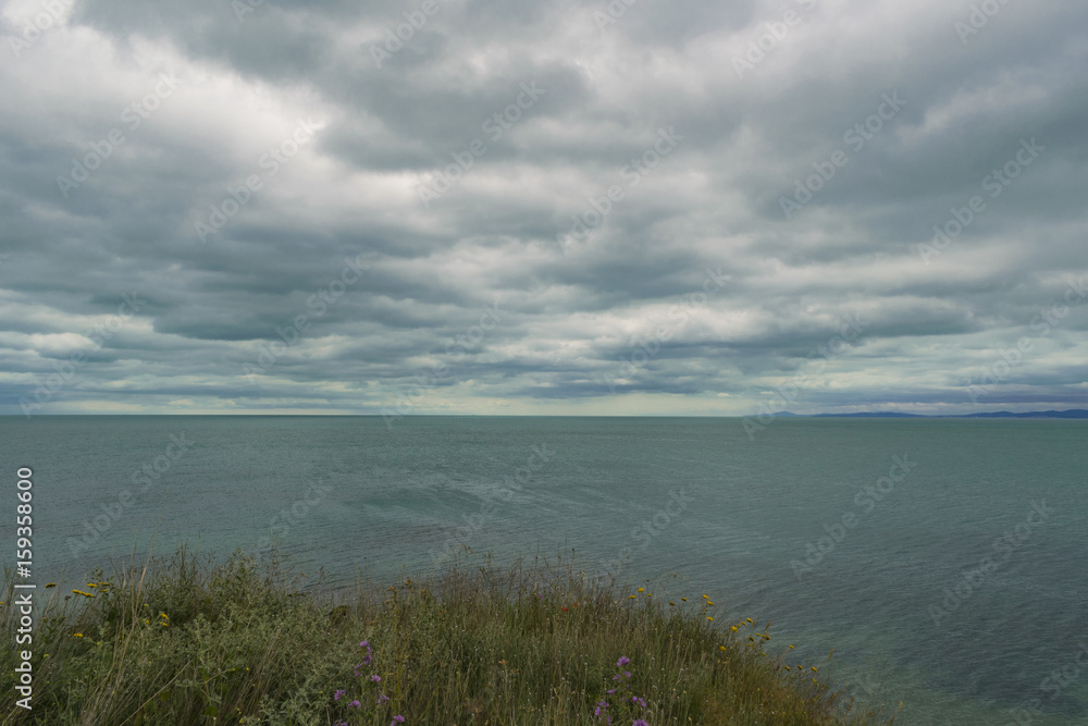 Calm sea with cloudy sky 