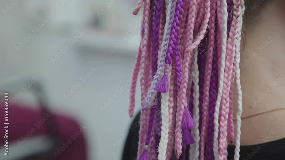 The process of weaving African braid with the use of kanekalon. Small ...