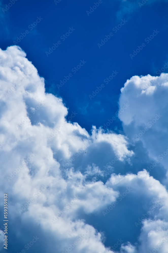 Blue sky with white and gray cumulus clouds. Closeup Blue sky with white and gray cumulus clouds. Closeup