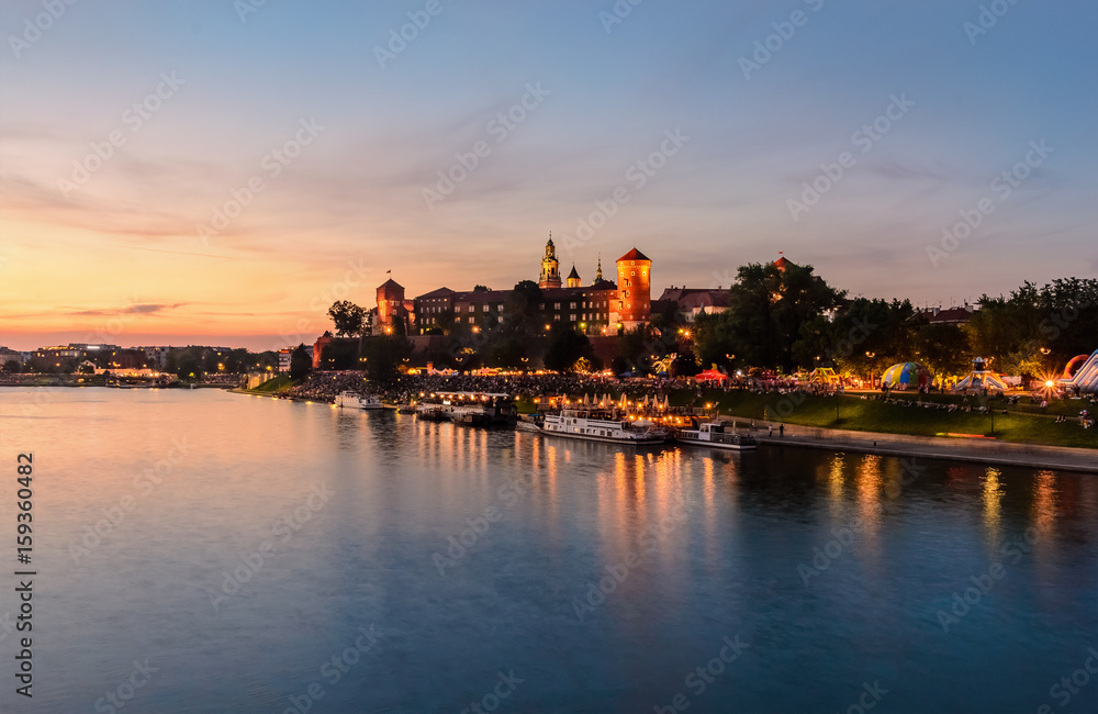 Wawel hill with castle in pink red sunset, Krakow