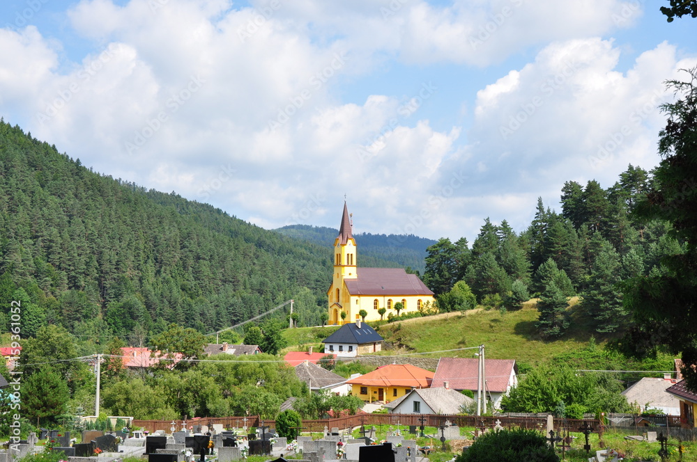 Slovakian village with a yellow church, Smolnicka Huta, Slovakia