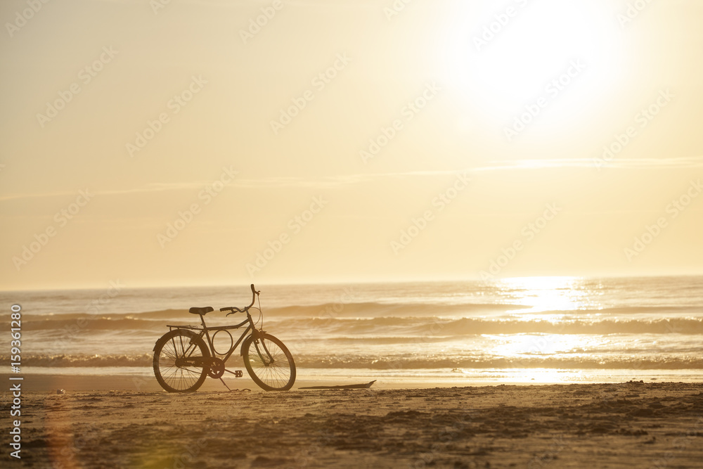 Fototapeta premium Bicycle on the beach sunset