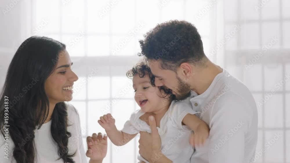 Parents playing with son