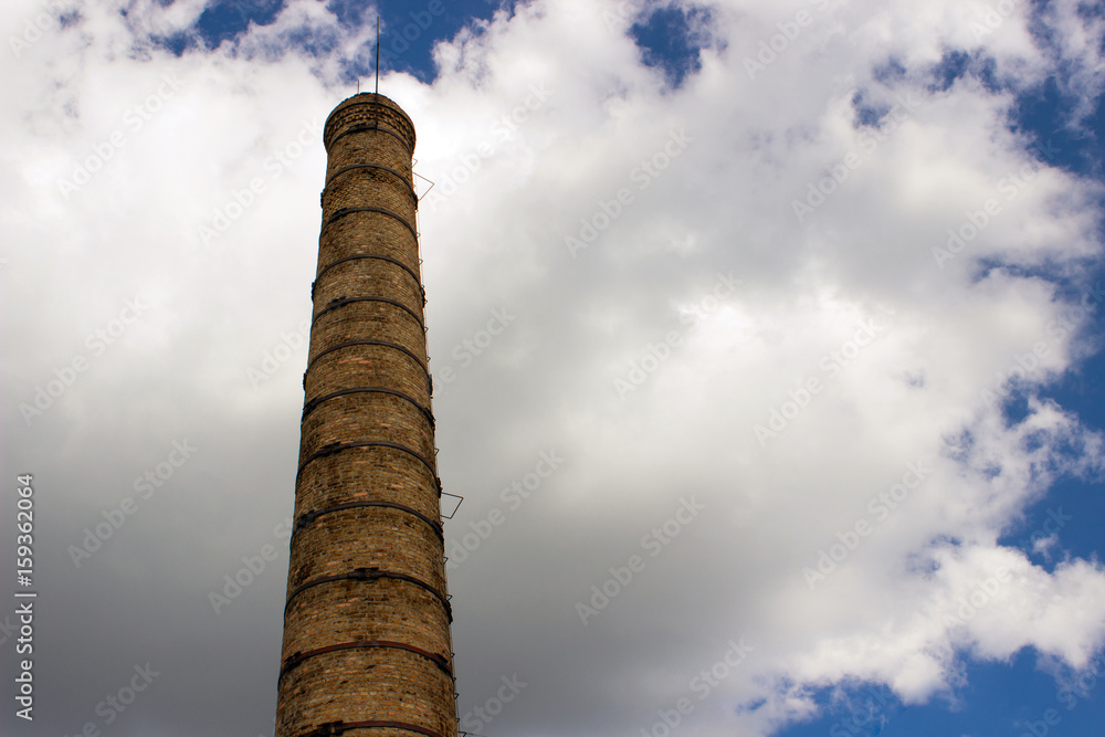 Factory, chimney, against the background of clouds