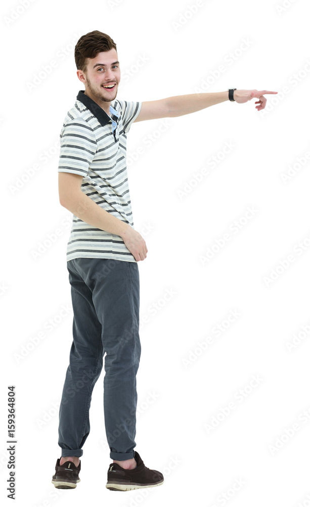 Young man pointing at something with his finger isolated on whit Young man pointing at something with his finger isolated on whit