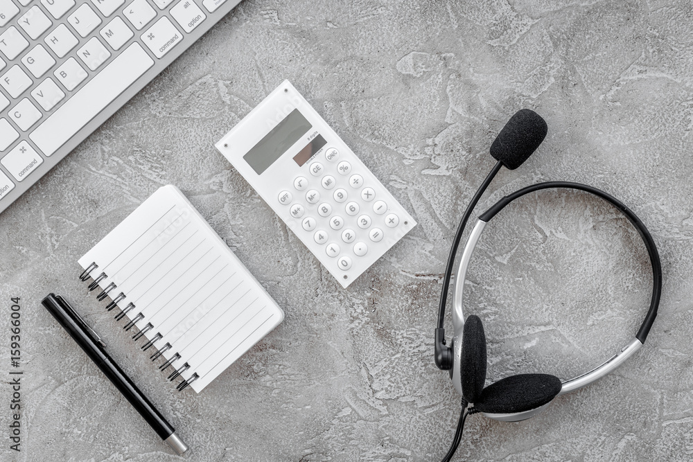 operator headset, notebook and keyboard for contact us feed back call center workdesk stone background top view mockup operator headset, notebook and keyboard for contact us feed back call center workdesk stone background top view mockup