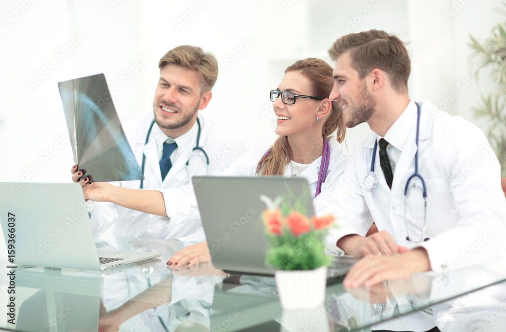 Portrait of confident happy group of doctors working at the medi Portrait of confident happy group of doctors working at the medi