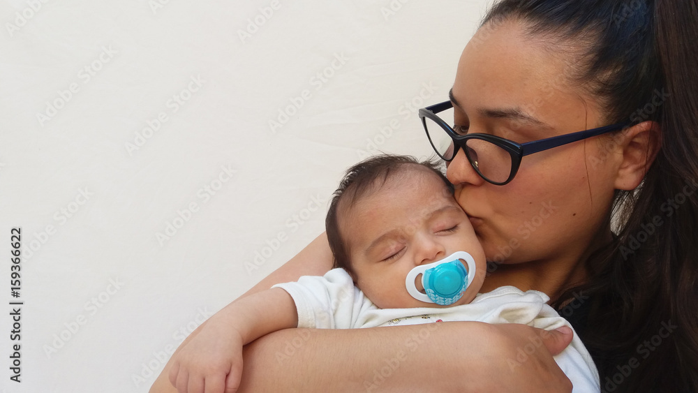 two months old sleeping baby in mams arms two months old sleeping baby in mams arms