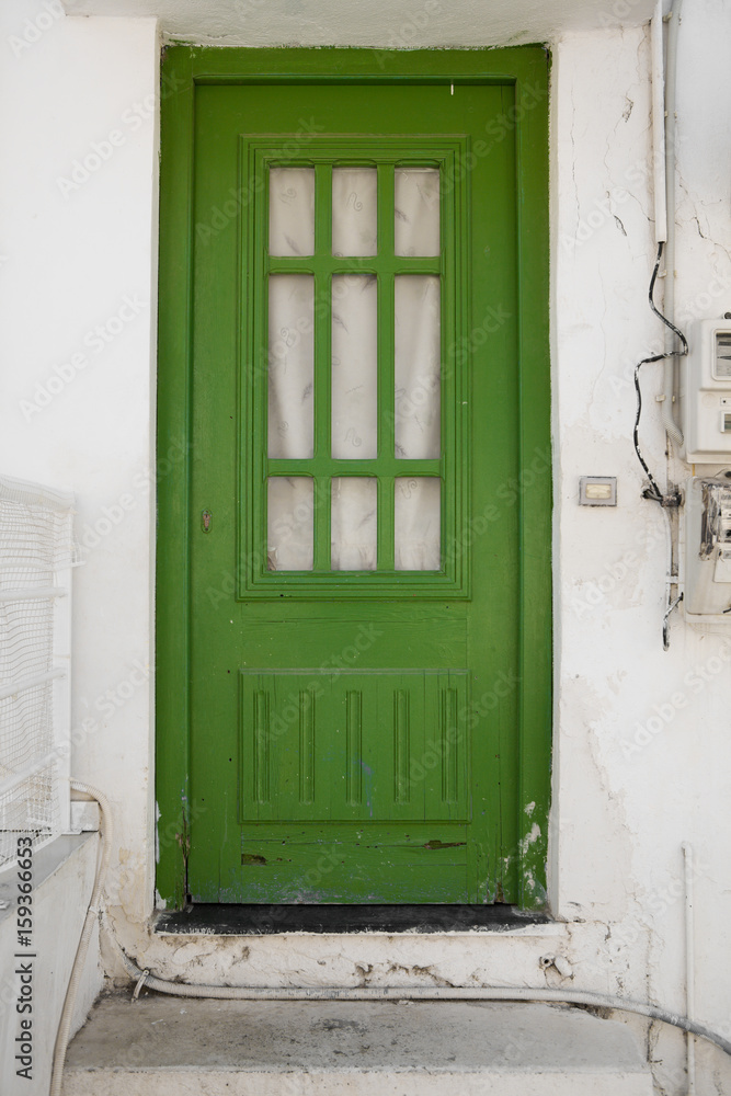 Green door in an old building