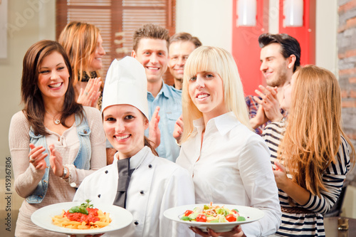 Chef And Waiter With Their Guests