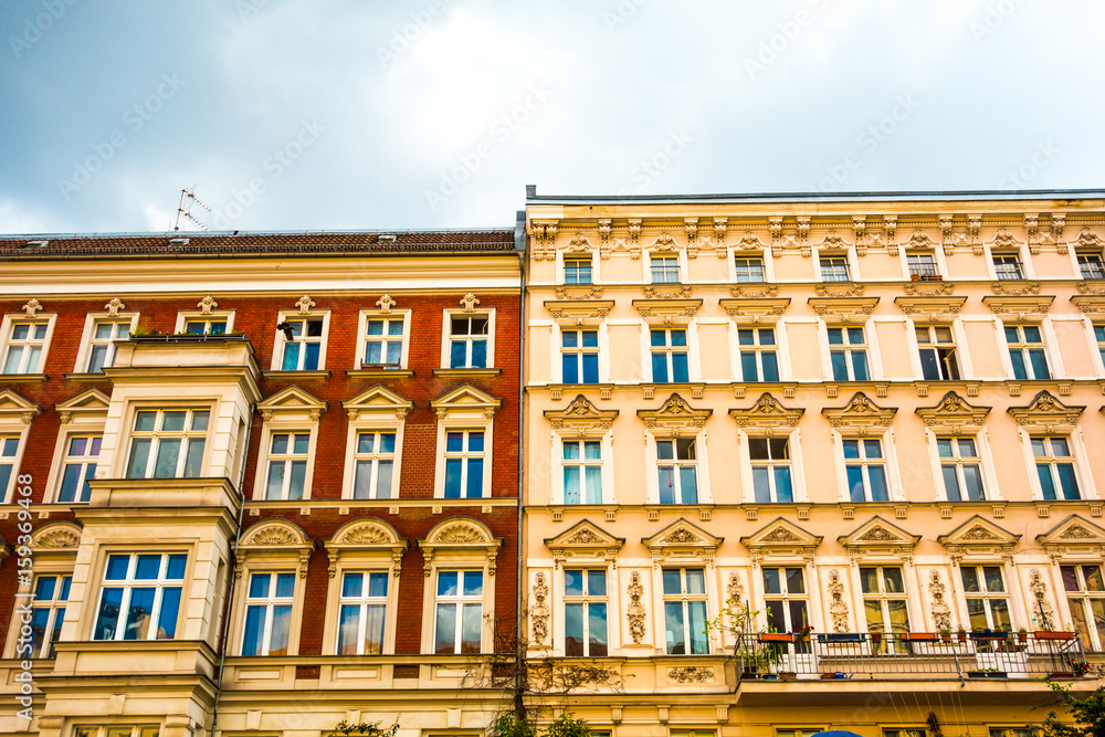 warm colored townhouses at berlin with ornaments