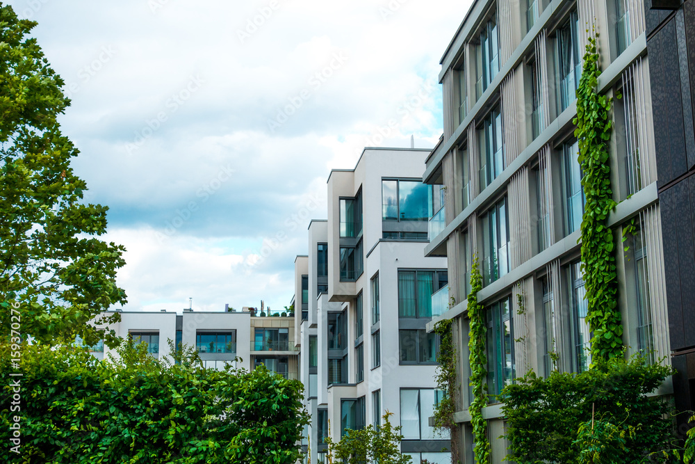 modern townhouses with beautiful evy and green trees