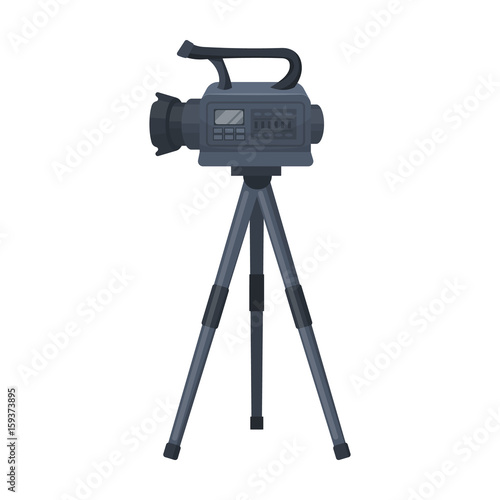 Movie camera on a tripod. Making a movie single icon in cartoon style vector symbol stock illustration web. photo