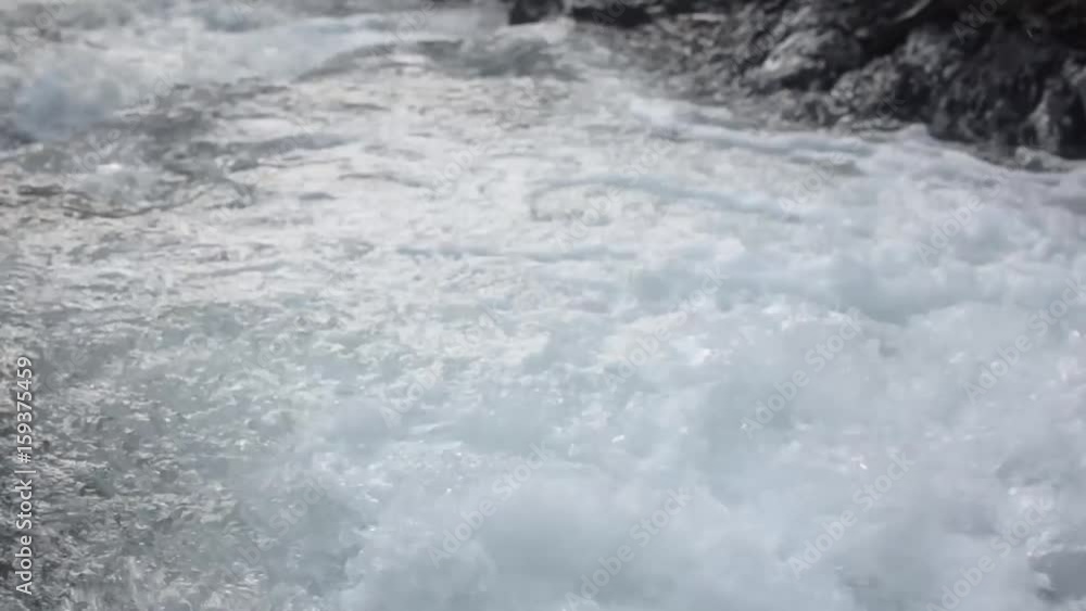 Water flow in the mountainous river Water flow in the mountainous river
