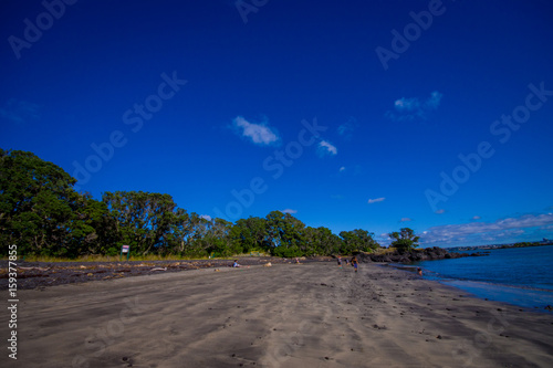 Beautiful view to Rangitoto Island from Karaka Bay Beach Auckland New Zealand in a blue sky in sunny day