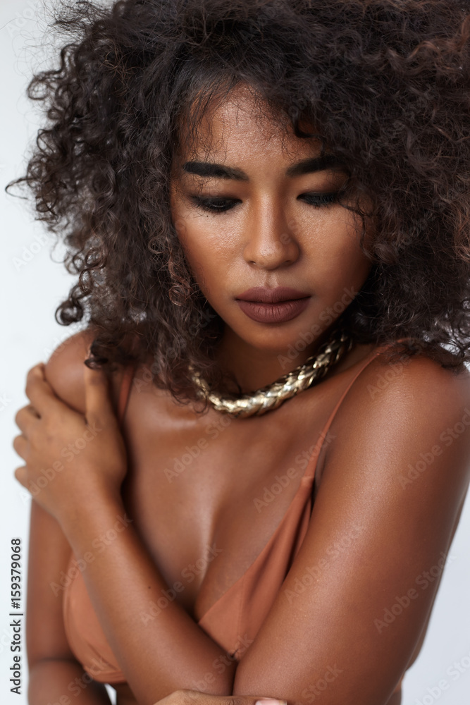Studio portrait ethnic dark skin female model in bikini