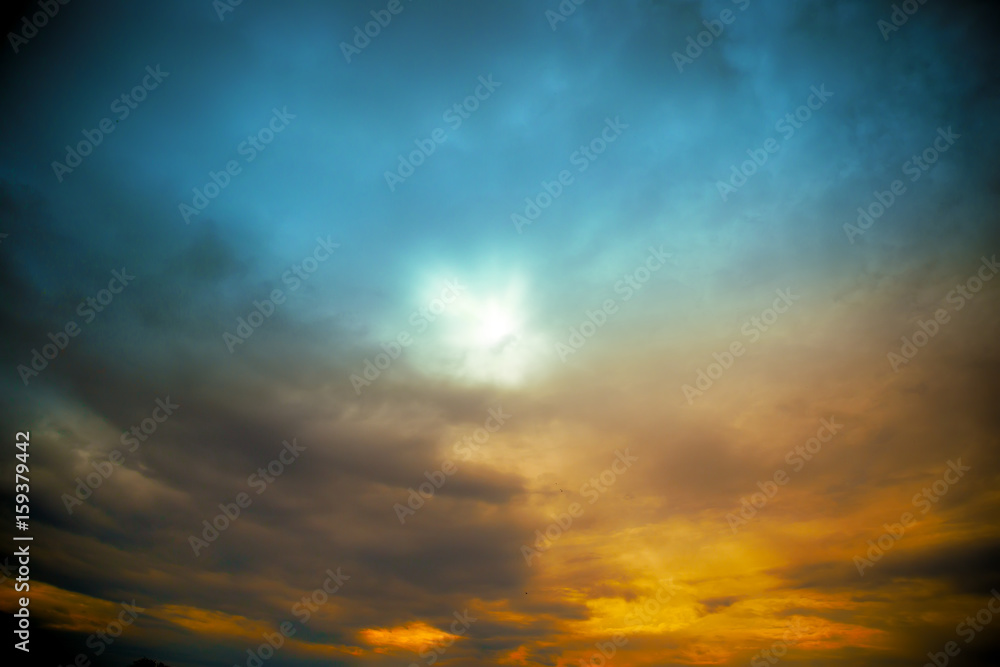 sun with rays at colored cloudscape dramatic view