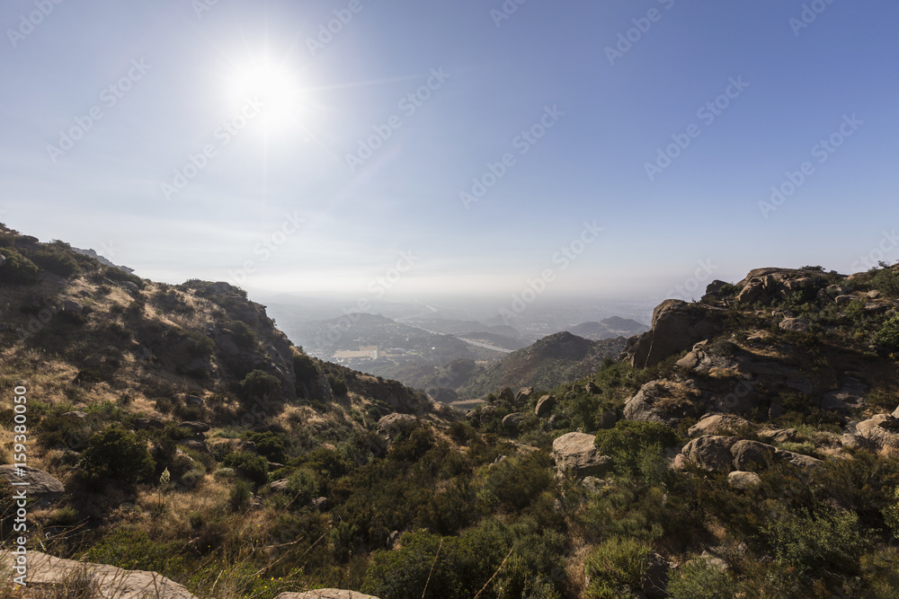 Morning sun above the San Fernando Valley in Los Angeles, California.  View from Rocky Peak Park in the Santa Susana Mountains.  
