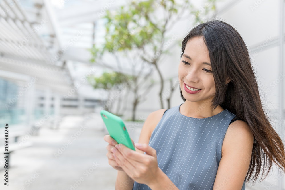 Businesswoman use of mobile phone
